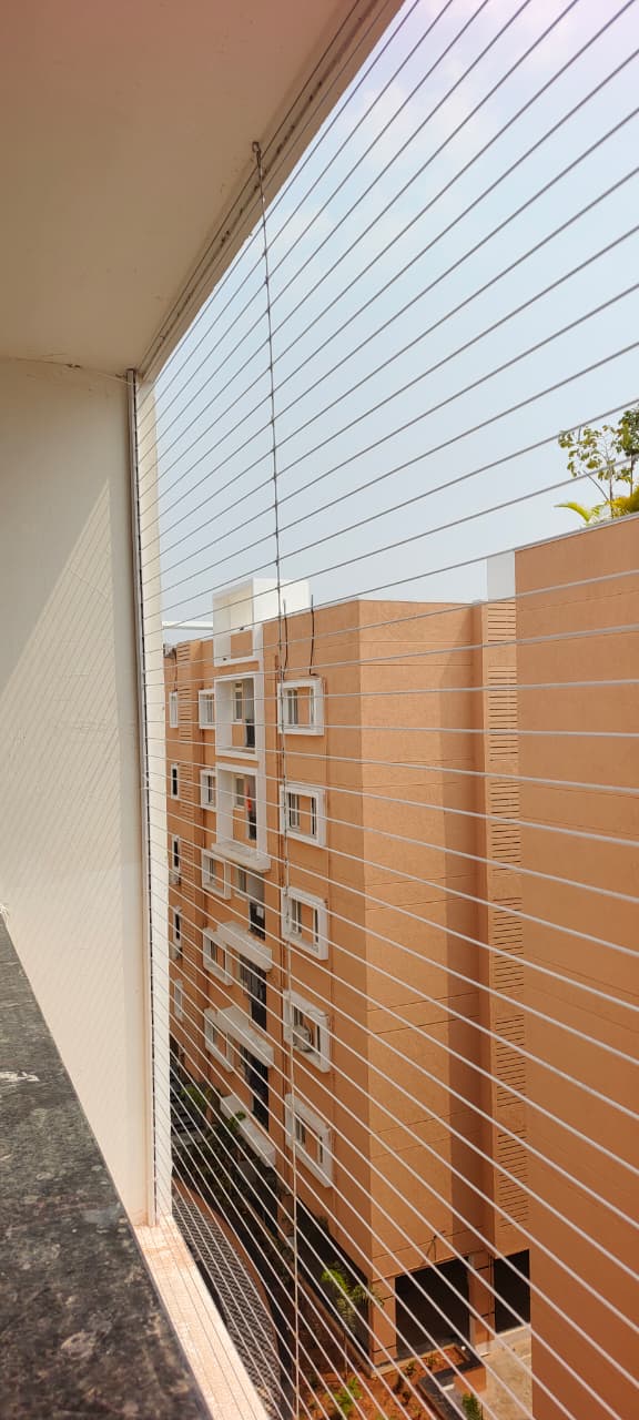 Invisible grill wires fitted to a balcony opening on a completed job